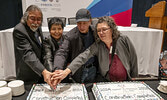 Frank Mckay, Margaret Kenequanash, Harry Meekis (FNLP Executive Council), and Lucie Edwards celebrate the end of the Wataynikaneyap Power transmission system’s construction.     Photo courtesy of Dan Garrity Media