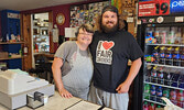 Debra Young showing her support to Cam Stewart after he devoured seven servings of mozza fries.   Angela Anderson / Bulletin Photo